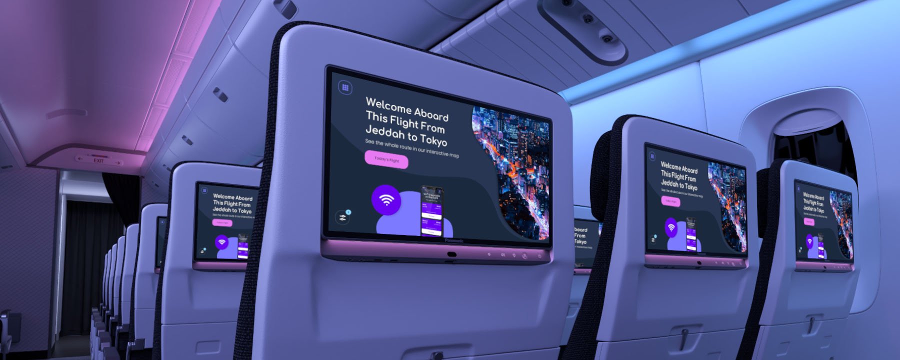 Airplane cabin seats with screens displaying a welcome message in blue and purple lighting