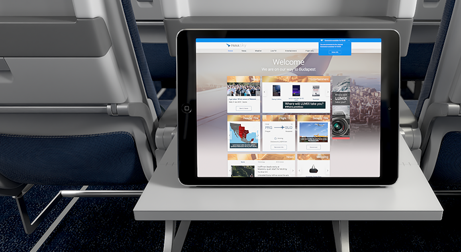 Tablet displaying a webpage on an airplane tray table